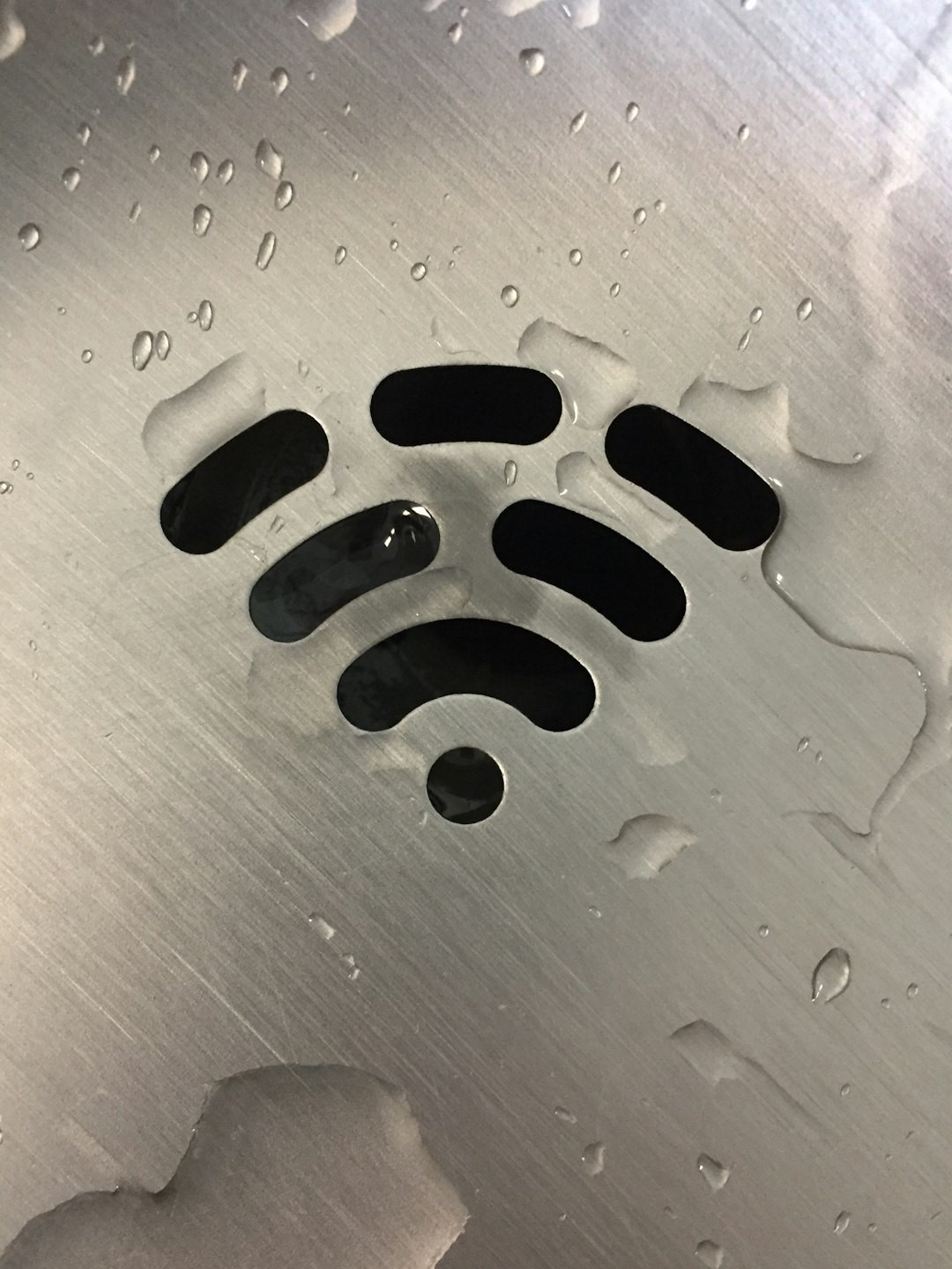 This is actually a water fountain drain that looks like the WiFi symbol.